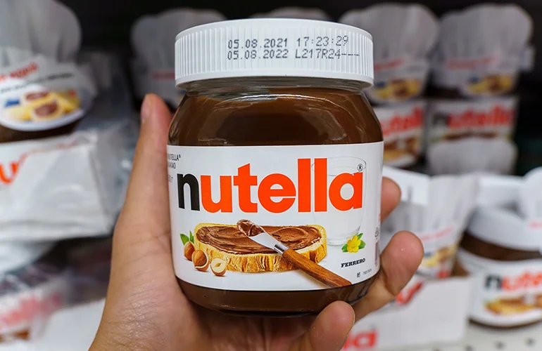  Nutella is a brand of hazelnut cocoa spread, and its main ingredients are sugar and palm oil (greater than 50%).