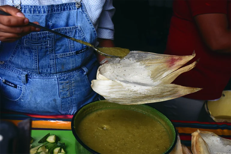 As well as being a staple good, maize is also the cornerstone of many traditions in Mexico. Here  'Tamales', a traditional Mexican food, are being prepared celebrate the candlemas day. Tamales are made of corn dough and butter and are filled with chicken a