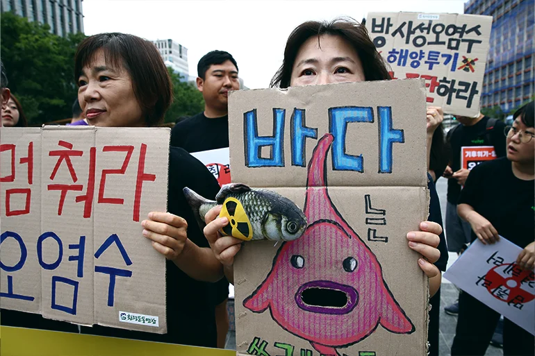 South Korean protesters participate in a rally against the Japanese government's decision to release treated radioactive water from its crippled Fukushima nuclear power plant into the Pacific Ocean, on August 24, 2023 in Seoul, South Korea. (Photo by Chung